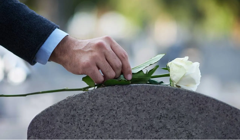 Placing Flowers on Grave