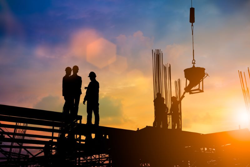 construction crew working at sunrise