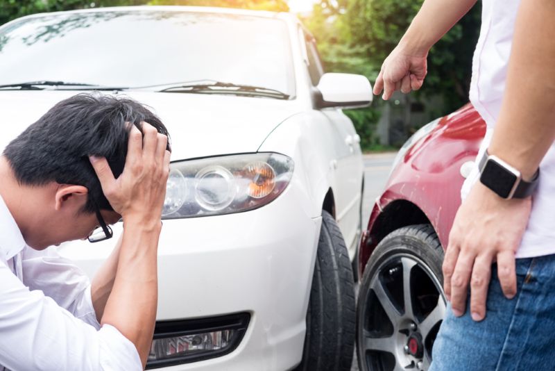 two drivers talking after a minor car accident