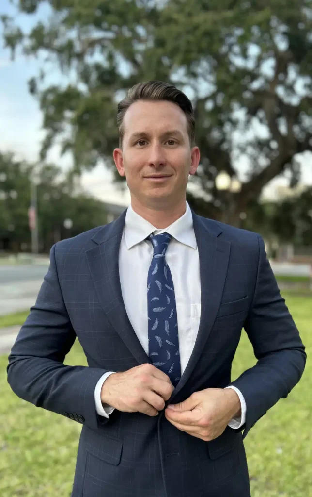 Attorney Adam Kemp fixing his buttons