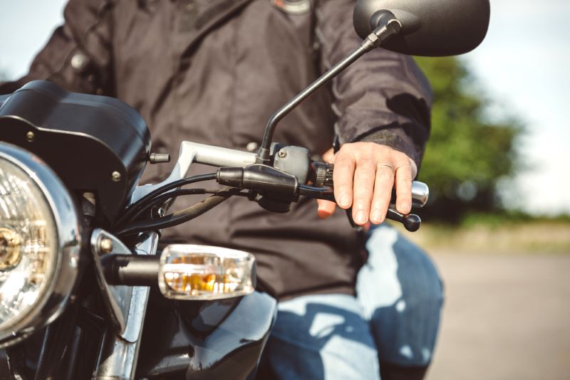 closeup of a man riding a motorcycle