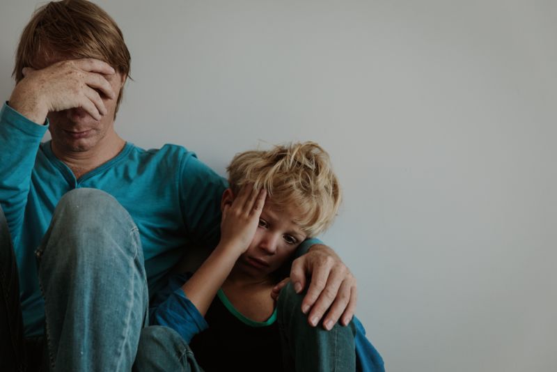 sad father and child