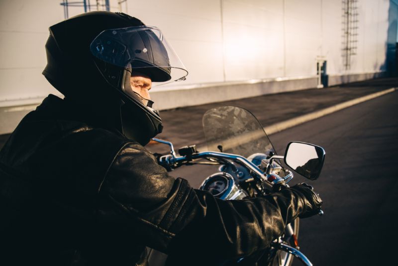 man riding a motorcycle during the evening