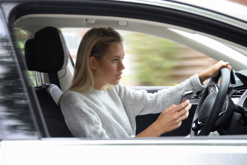 Woman texting and driving